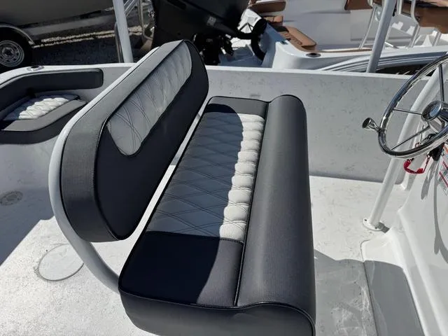 Slide: The Image of Boat interior with cushioned seating and steering wheel, ALK2 22CRS model, 2025. - 2