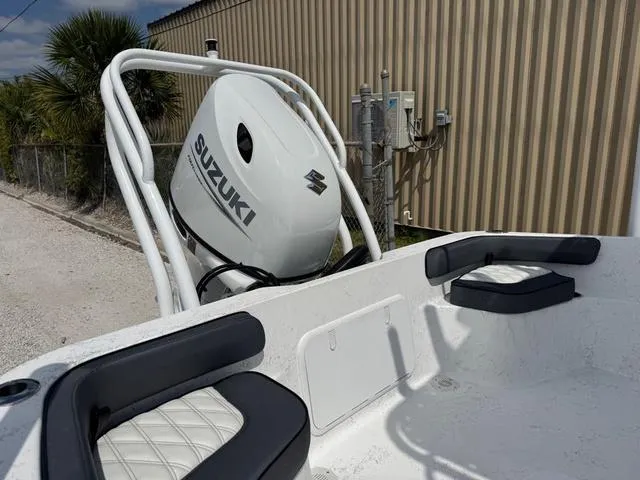 Slide: The Image of Boat with Suzuki outboard motor, ALK2 22CRS model, parked near a building, 2025. - 8