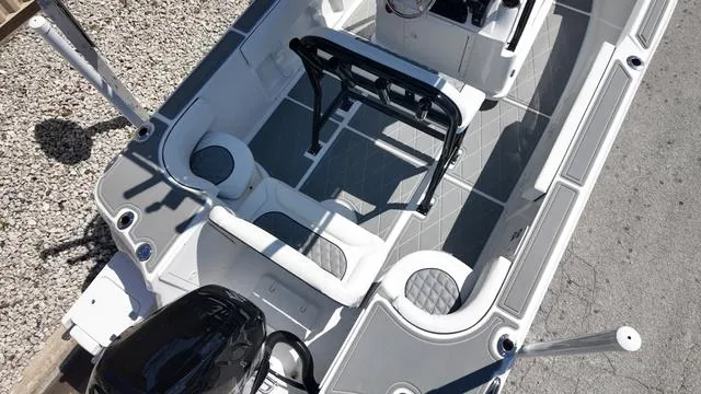 Slide: The Image of 2025 Polar 195 CC boat interior with seating and steering console, viewed from above. - 14