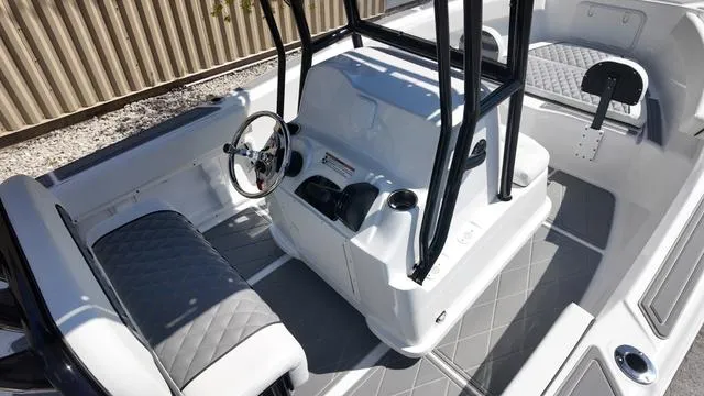 Slide: The Image of 2025 Polar 195 CC boat interior with modern steering and seating design. - 15