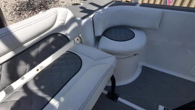 Slide: The Image of 2025 Polar 195 CC boat interior with cushioned seating and storage area. - 17