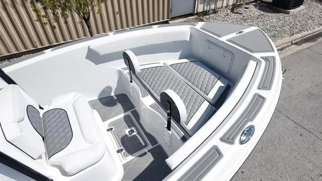 Slide: The Image of 2025 Polar 195 CC boat interior with gray cushioned seating and modern design. - 2