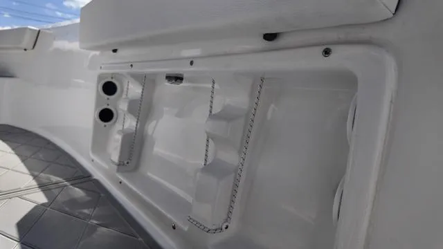 Slide: The Image of 2025 Polar 195 CC boat interior detail with storage compartments and sleek design. - 21