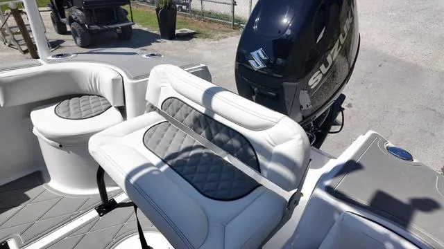 Slide: The Image of 2025 Polar 195 CC boat interior with Suzuki outboard motor, featuring cushioned seating. - 22