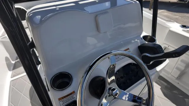 Slide: The Image of 2025 Polar 195 CC boat console with steering wheel and controls. - 24