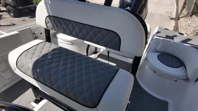 Slide: The Image of 2025 Polar 195 CC boat interior with quilted gray seating and modern design. - 25