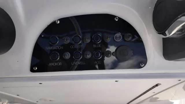 Slide: The Image of Control panel of 2025 Polar 195 CC boat with labeled switches. - 26