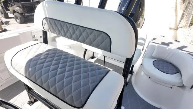 Slide: The Image of 2025 Polar 195 CC boat interior with quilted gray and white seating. - 27