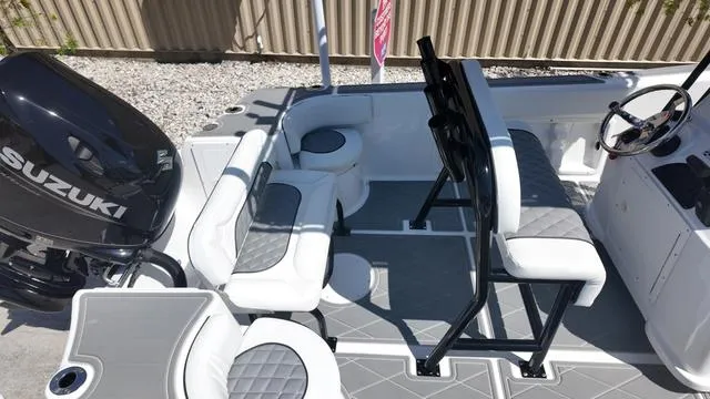 Slide: The Image of 2025 Polar 195 CC boat interior with Suzuki engine, featuring white and gray seating. - 3