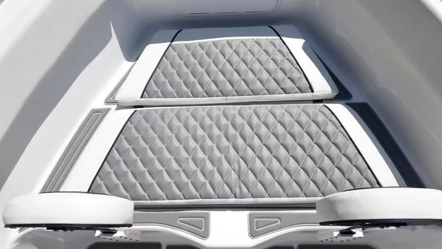 Slide: The Image of 2025 Polar 195 CC boat interior with diamond-stitched gray seating. - 32