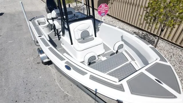 Slide: The Image of 2025 Polar 195 CC boat with sleek design, parked on a concrete surface. - 9