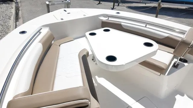 Slide: The Image of 2026 Sea Born LX22 Center Console on trailer outdoors. - 6