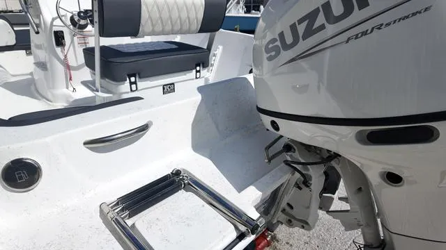 Slide: The Image of Boat with Suzuki outboard motor and ladder, ALK2 18CRS model, 2025. - 12