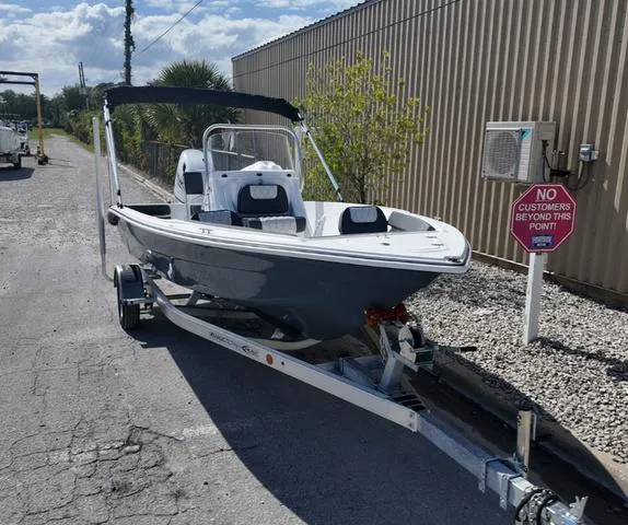 Slide: The Image of 2025 ALK2 18CRS boat on trailer near industrial building. - 15