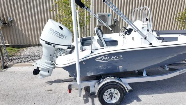 Slide: The Image of 2025 ALK2 18CRS boat with Suzuki outboard motor on a trailer. - 24