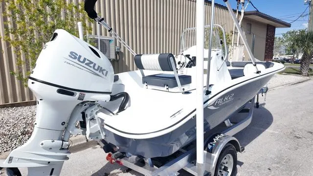 Slide: The Image of 2025 ALK2 18CRS boat with Suzuki outboard motor on a trailer. - 26