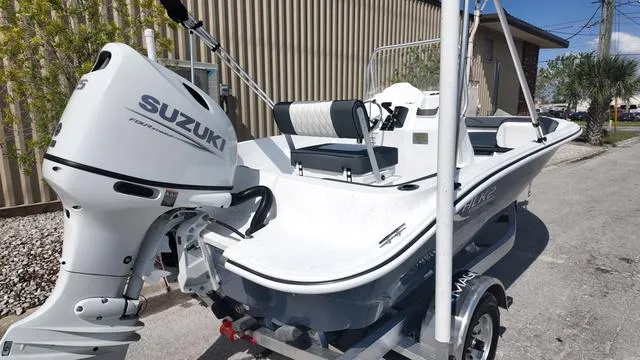 Slide: The Image of 2025 ALK2 18CRS boat with Suzuki outboard motor on a trailer. - 29
