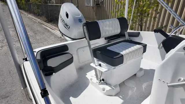 Slide: The Image of 2025 ALK2 18CRS boat interior with Suzuki outboard motor, featuring cushioned seating and sleek design. - 3
