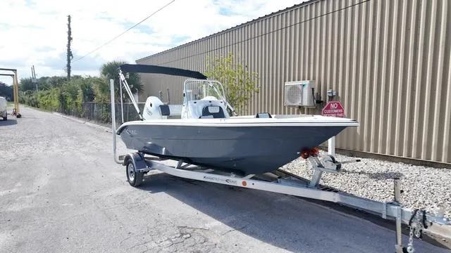 Slide: The Image of 2025 ALK2 18CRS boat on trailer near industrial building. - 34