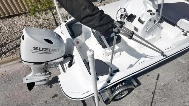 Slide: The Image of Small white boat with Suzuki outboard motor, ALK2 18CRS model, 2025. - 35