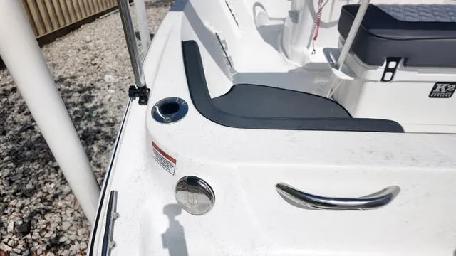 Slide: The Image of 2025 ALK2 18CRS boat interior with cup holder and seating area. - 40