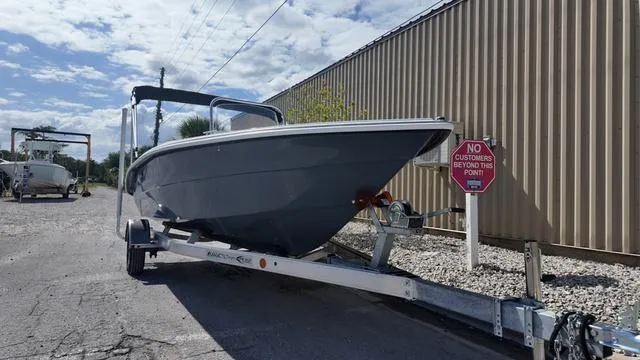 Slide: The Image of 2025 ALK2 18CRS boat on trailer near a "No Customers Beyond This Point" sign. - 48