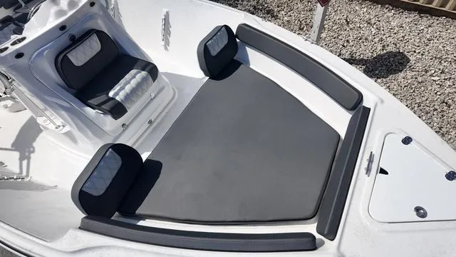 Slide: The Image of 2025 ALK2 18CRS boat interior with cushioned seating and sleek design. - 8