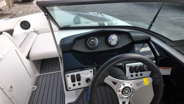 Slide: The Image of 2013 Yamaha Boats SX192 dashboard with steering wheel and control panel. - 17