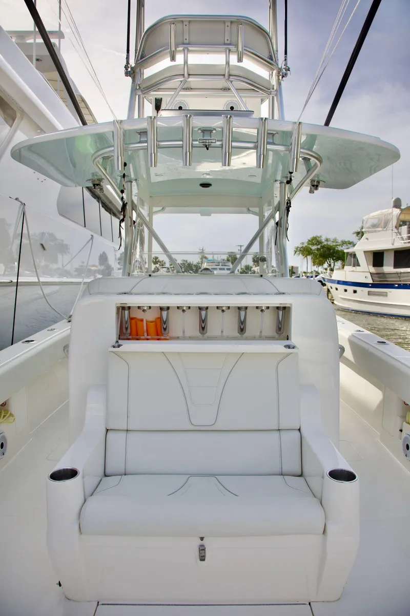 Slide: The Image of 2024 SeaVee 390Z boat interior with seating and fishing rod holders. - 11