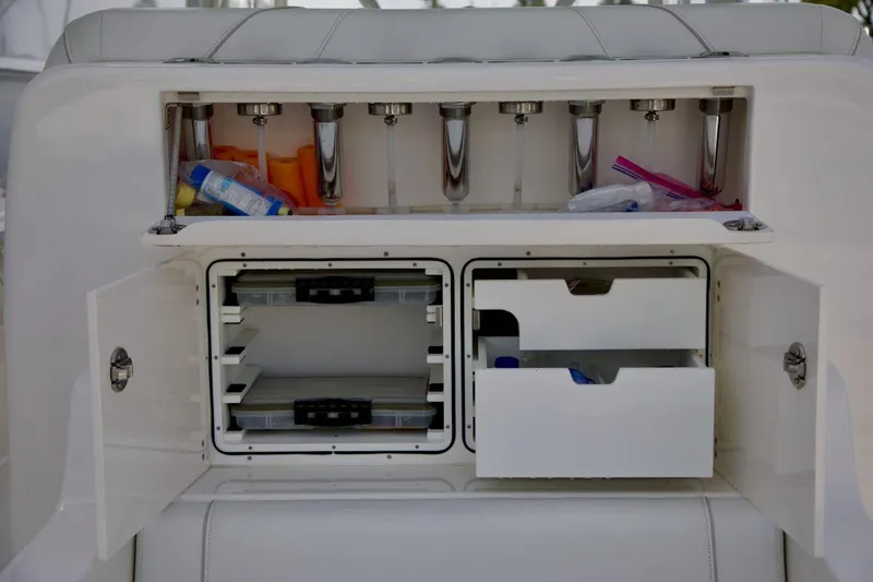 Slide: The Image of 2024 SeaVee 390Z boat storage compartments with open drawers and shelves. - 12