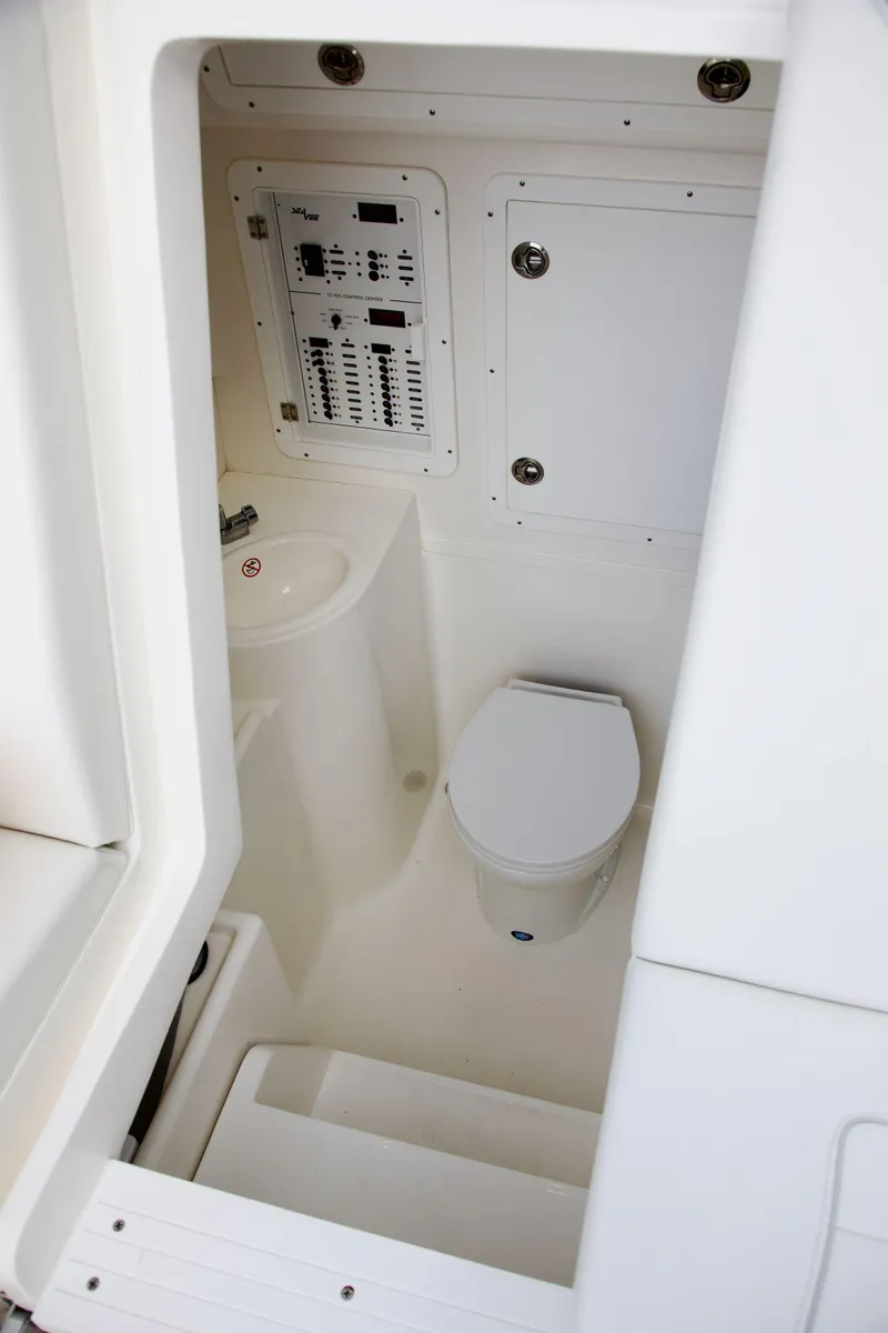 Slide: The Image of 2024 SeaVee 390Z boat interior with toilet and control panel. - 13