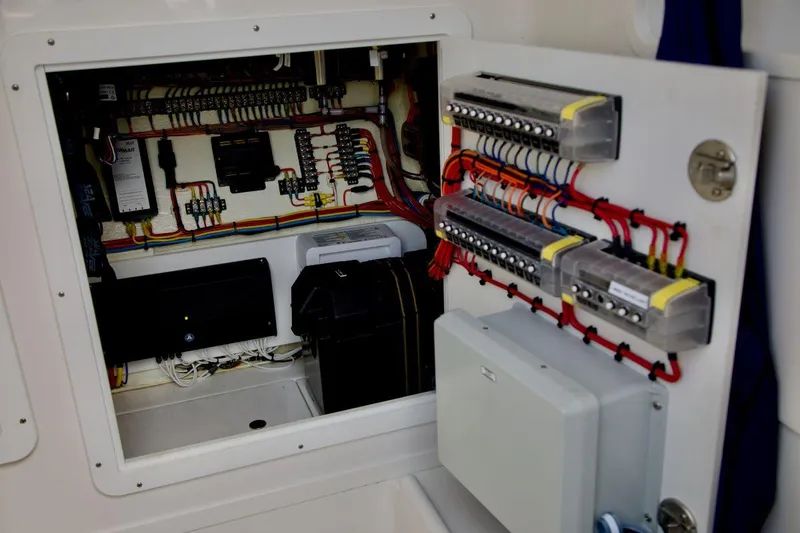 Slide: The Image of Electrical panel inside 2024 SeaVee 390Z boat, showcasing wiring and components. - 14