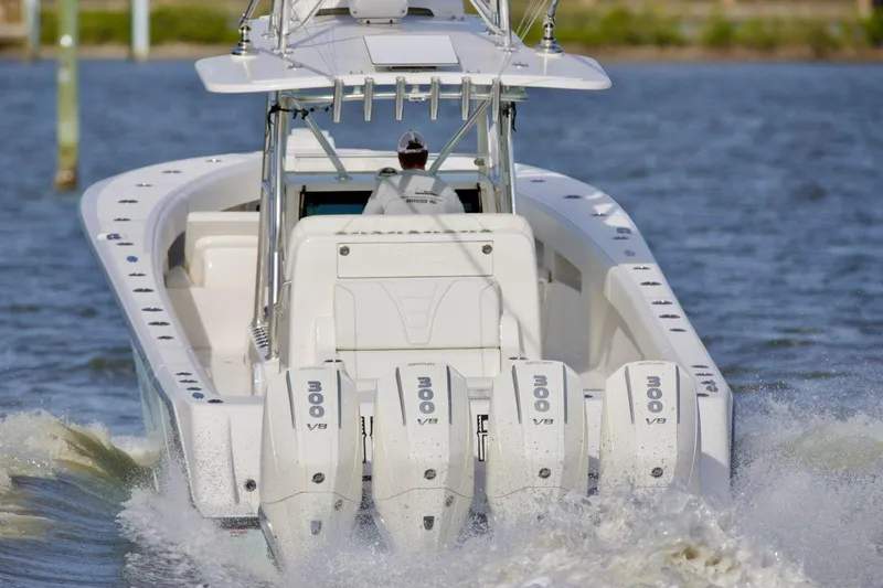 Slide: The Image of 2024 SeaVee 390Z boat with quad engines cruising on water. - 3