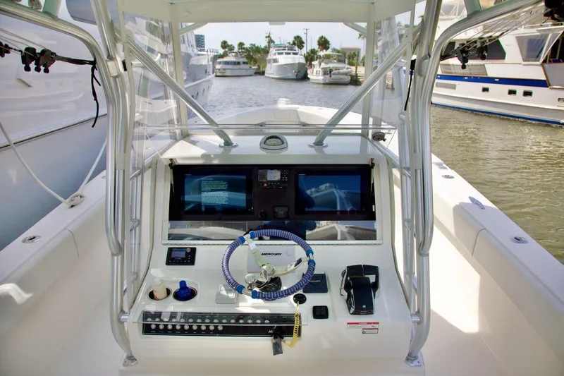 Slide: The Image of 2024 SeaVee 390Z boat cockpit with advanced navigation system and steering wheel. - 6