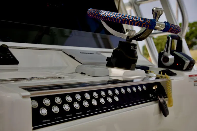 Slide: The Image of 2024 SeaVee 390Z boat dashboard with colorful steering wheel and control panel. - 8