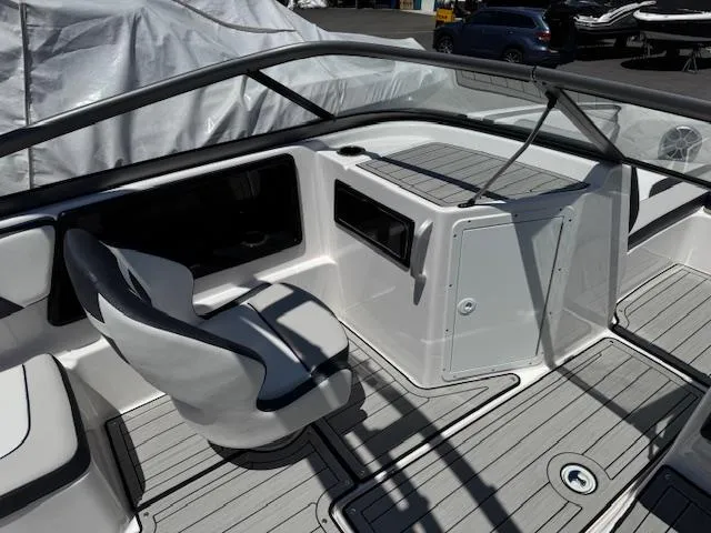Slide: The Image of 2021 Yamaha Boats 195S interior with sleek seating and modern dashboard design. - 12