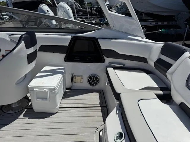 Slide: The Image of 2021 Yamaha Boats 195S interior with seating and cooler on deck. - 18