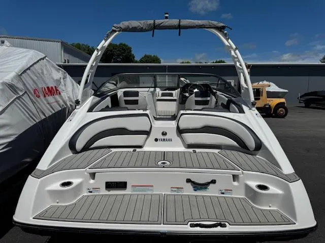 Slide: The Image of 2021 Yamaha Boats 195S, rear view, showcasing spacious seating and sleek design. - 22