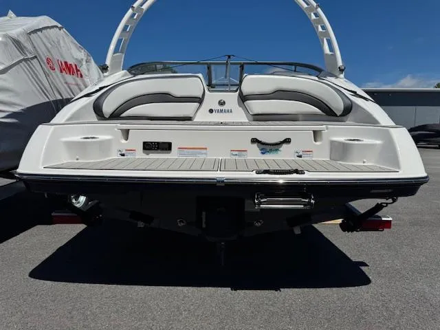Slide: The Image of 2021 Yamaha Boats 195S, rear view, showcasing sleek design and swim platform. - 24