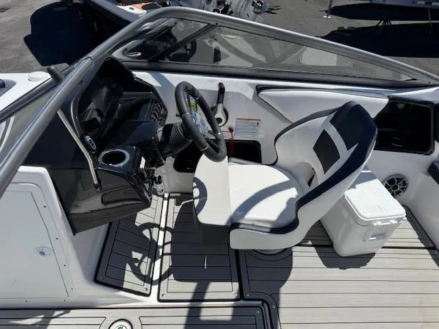 Slide: The Image of 2021 Yamaha Boats 195S cockpit with steering wheel and captain's chair. - 7