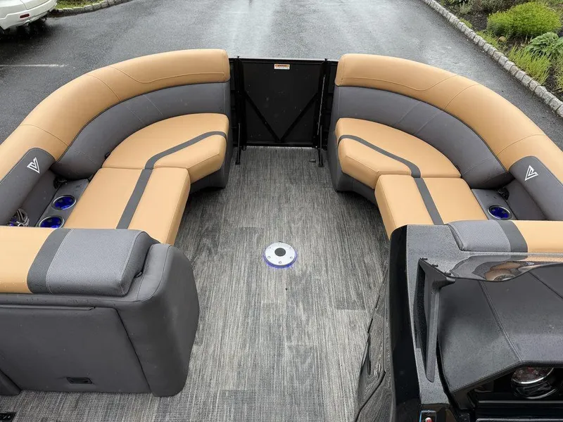 Slide: The Image of 2025 Viaggio X20U Tri-Toon boat interior with tan and gray seating, spacious layout. - 10