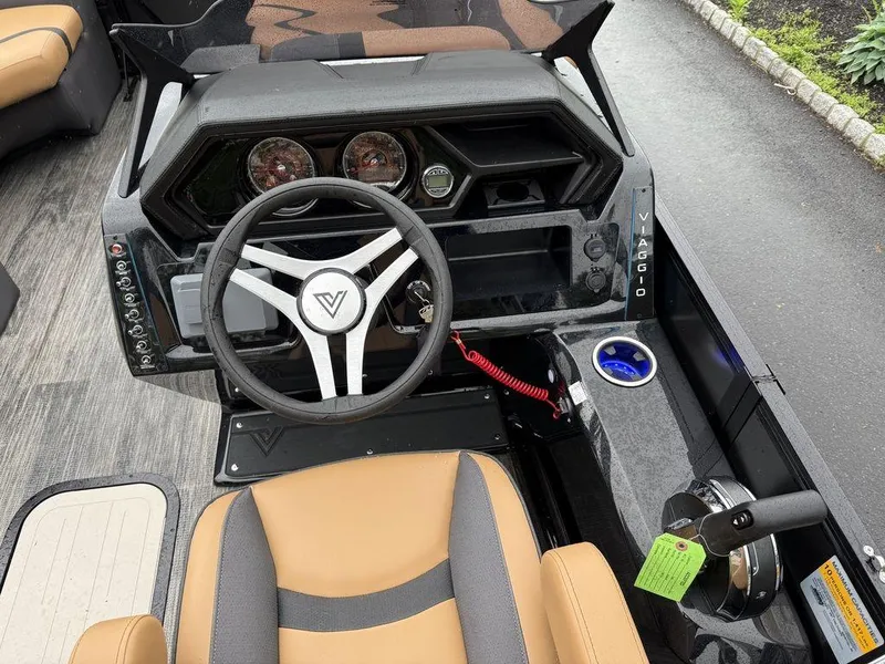 Slide: The Image of 2025 Viaggio X20U Tri-Toon dashboard with steering wheel and control panel, featuring modern design. - 11