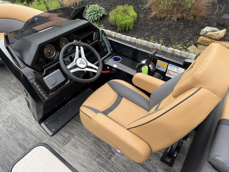Slide: The Image of 2025 Viaggio X20U Tri-Toon boat interior with tan seats and modern dashboard. - 8