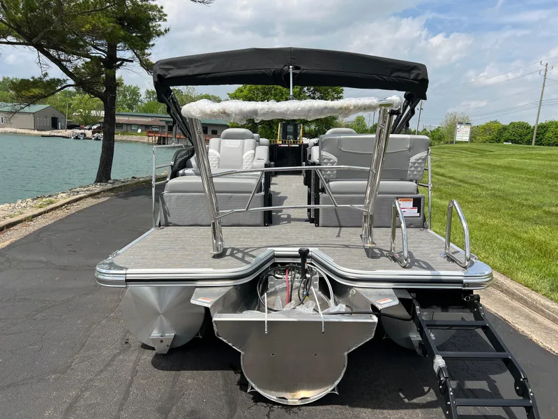Slide: The Image of 2025 Crest Classic 220 SLRC pontoon boat with spacious seating and sleek design. - 6