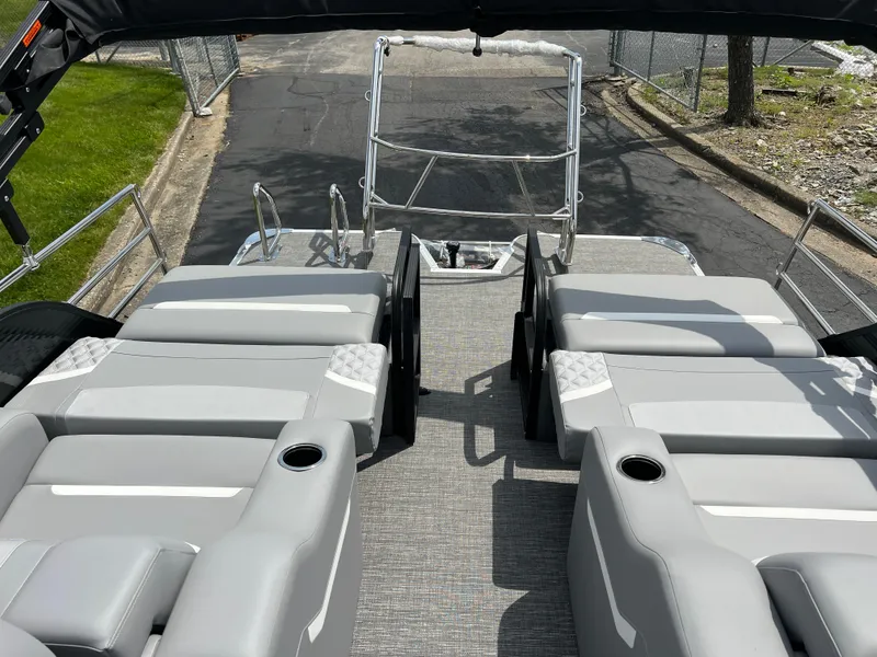 Slide: The Image of 2025 Crest Classic 220 SLRC pontoon boat with spacious seating and sleek design. - 7