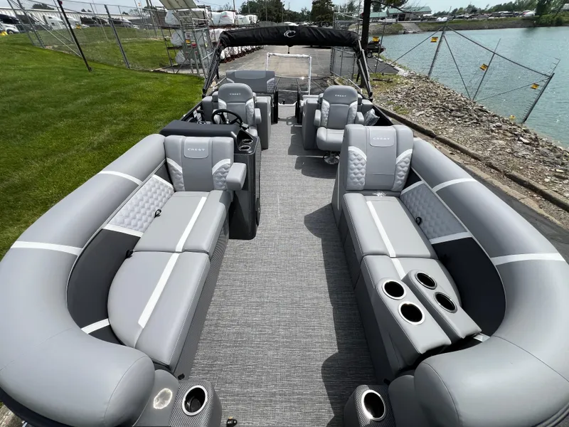 Slide: The Image of 2025 Crest Classic 220 SLRC pontoon boat with luxurious seating and modern design. - 8