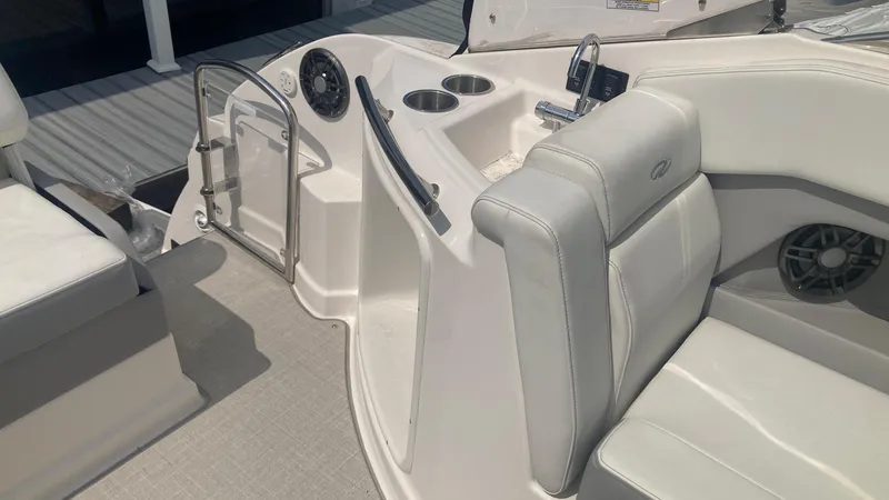 Slide: The Image of 2025 Regal 28 Express boat interior with white seating and modern design. - 4