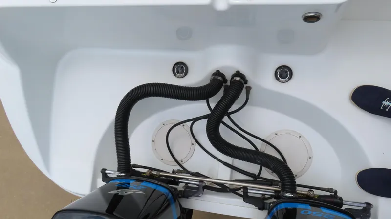 Slide: The Image of 2002 Baja 340 Sportfish boat engine compartment with visible wiring and hoses. - 14