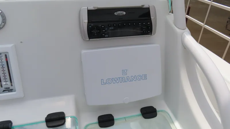 Slide: The Image of Baja 340 Sportfish 2002 dashboard with Lowrance equipment and stereo system. - 15