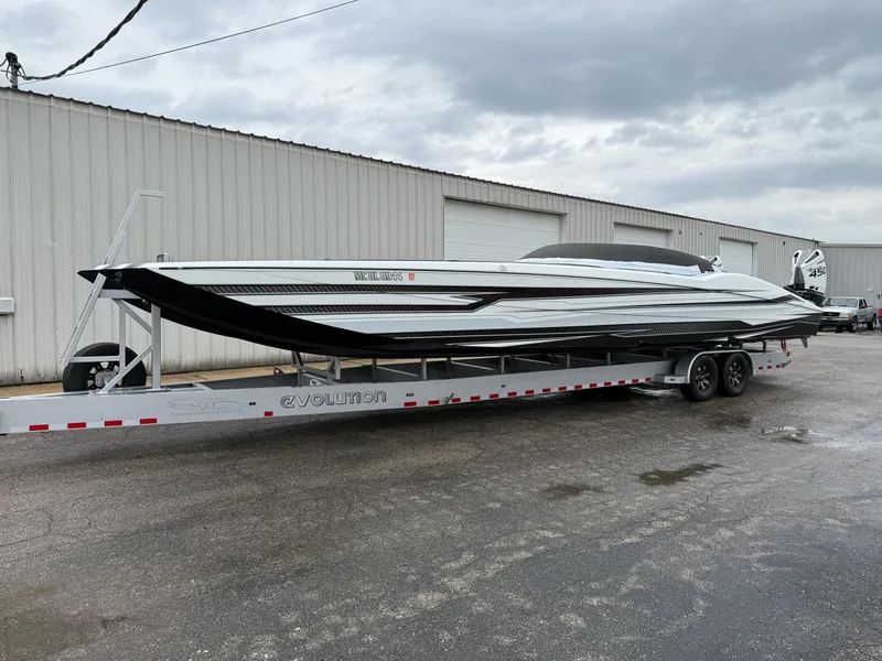Slide: The Image of 2021 MTI 390X powerboat on trailer, parked outside industrial building. - 7